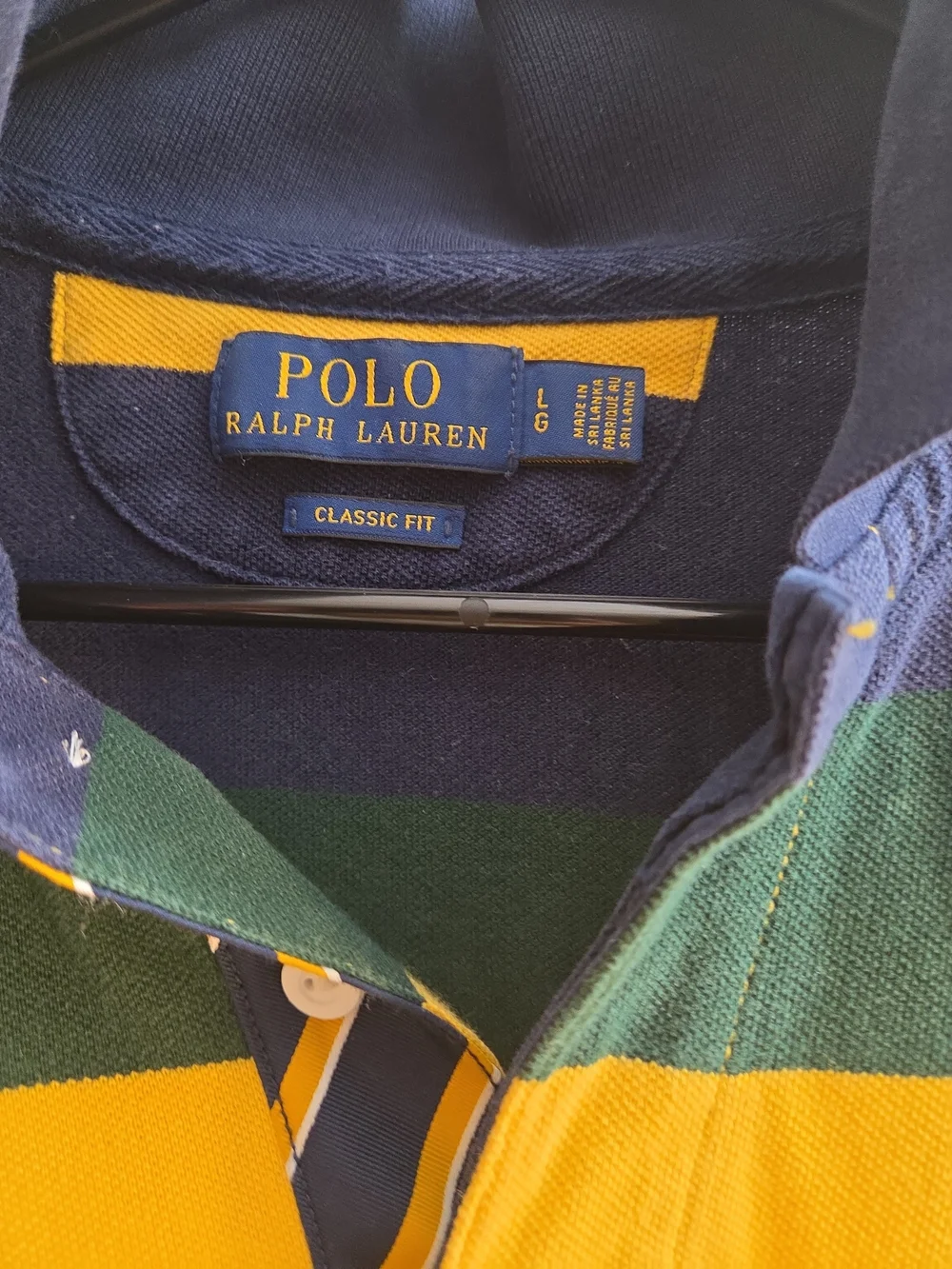 A Polo Ralph Lauren navy, yellow, and green striped short-sleeve.